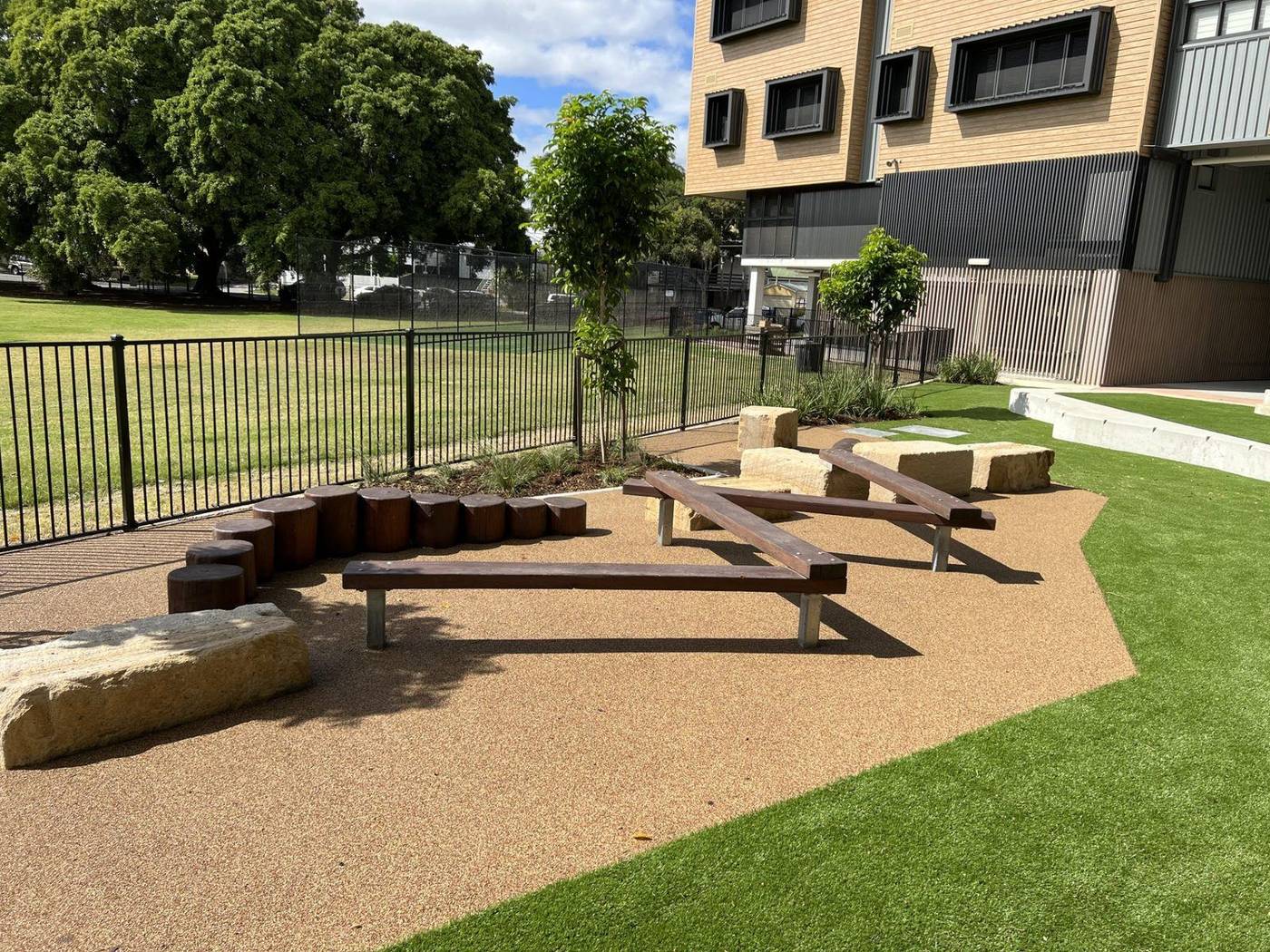 Rubber softfall playground surfacing with coloured feature circles