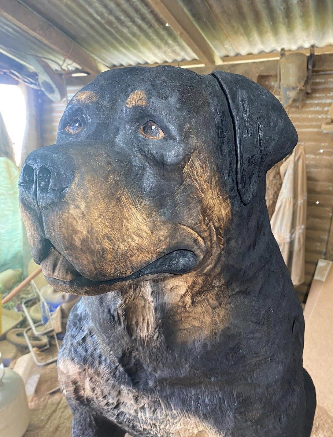 Chainsaw-carved Rottweiler by Cossy's Chainsaw Artistry