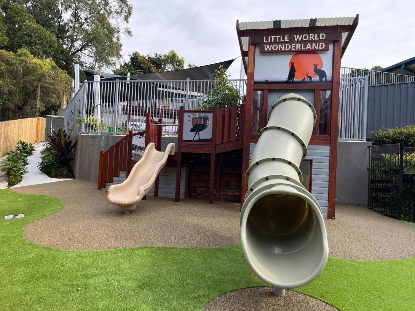 Custom childcare play structure with slides and Australian animal artwork panels